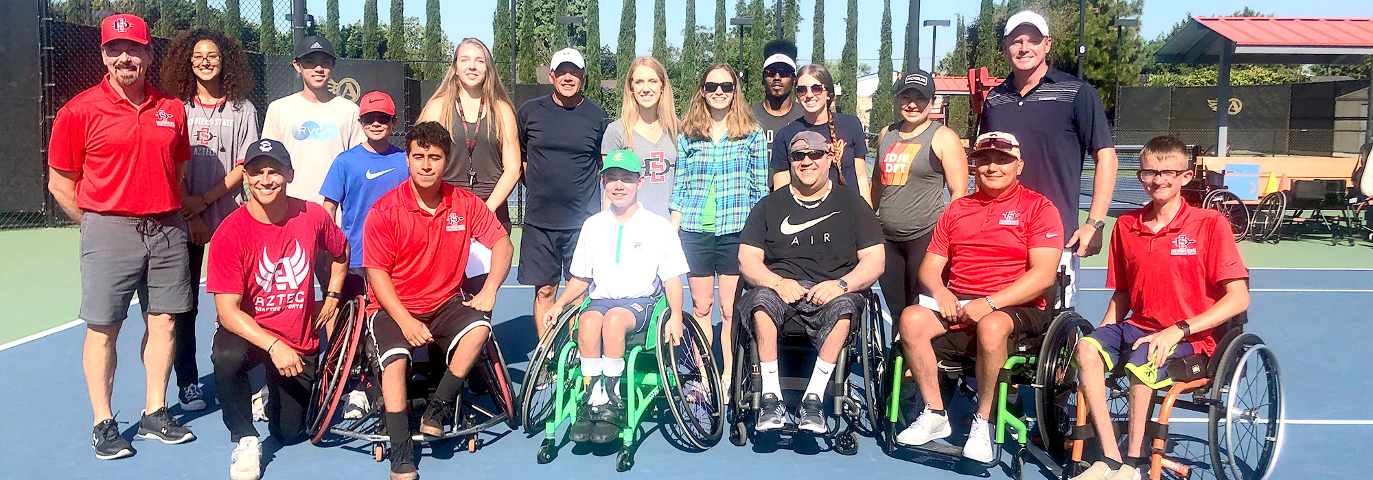 Group of Adapted Athletics Partners/Coaches/Staff/Athletes on tennis court