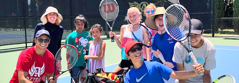 Adapted Athletics Tennis Players posing with tennis raquets