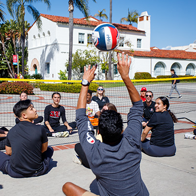 Adaptive athletes participating in seated volleyball.