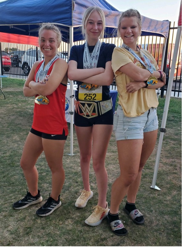 Three para-athletes posing for a photo.