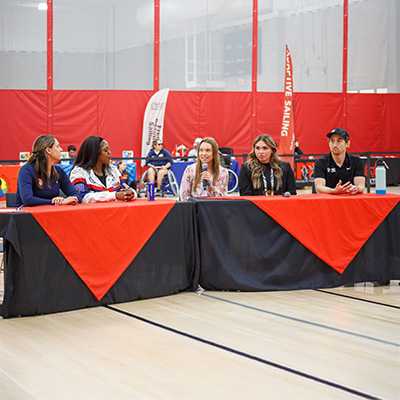 Members of the Paralympic discussion panel sitting at a table.