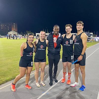 Left to right: Ana Firvida,  Michelle Cross,  Coach Rolland Slade, Austin Spalla, and TJ Donnan.