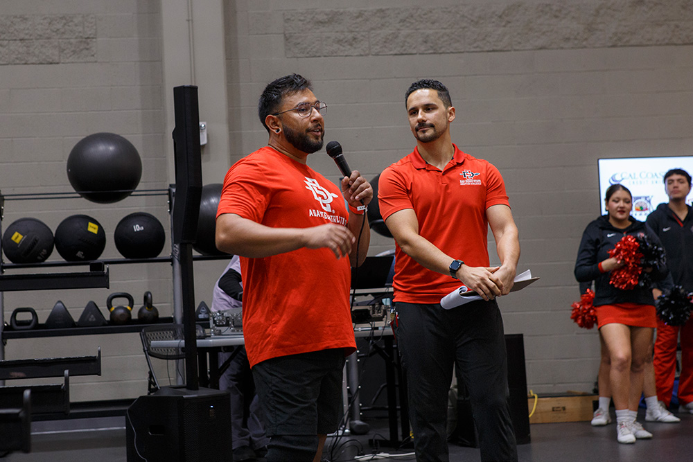 A.J. Munoz and an Adapted Athletics team member speak at the 2025 Lift-a-Thon.