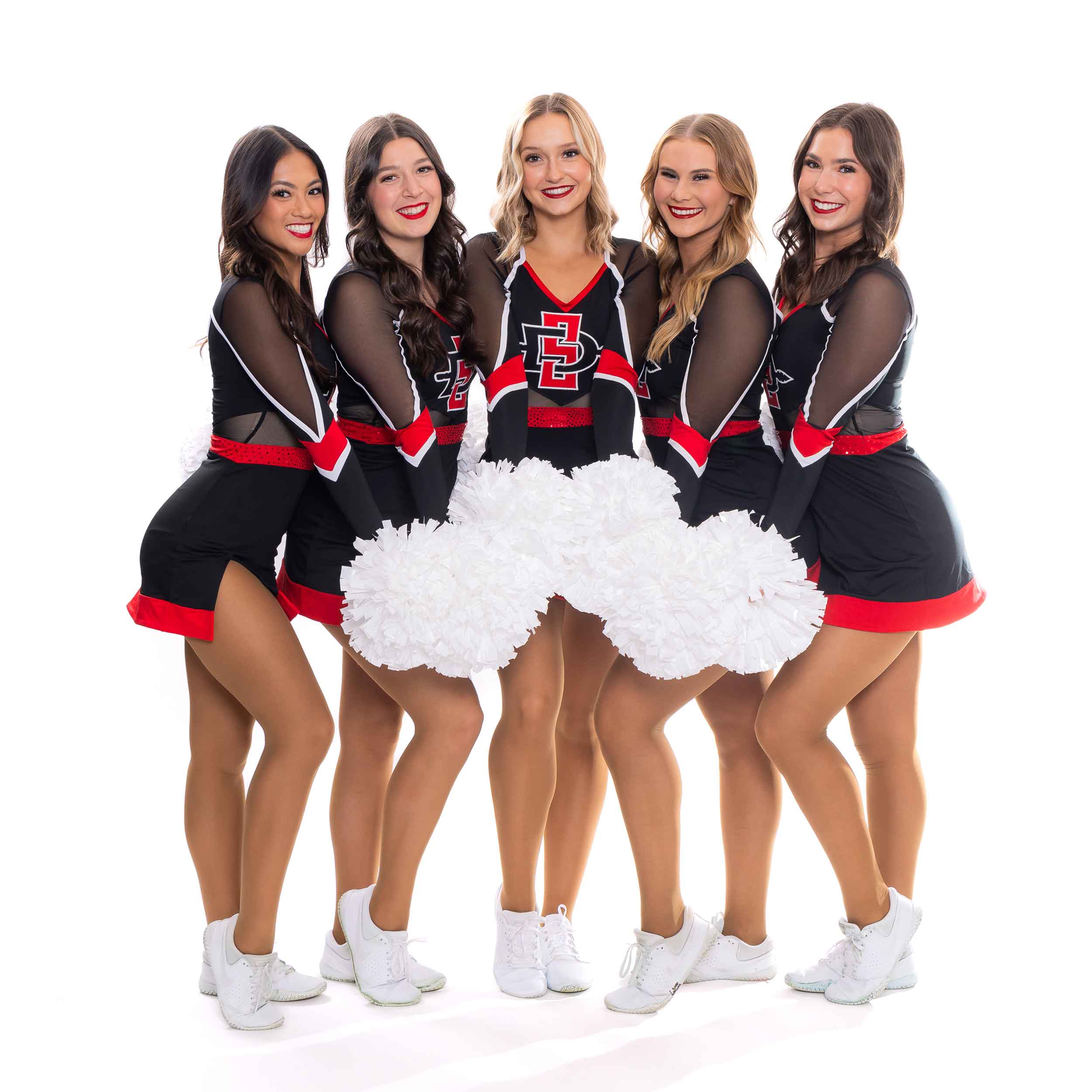 Five smiling Dance Team members against a white background