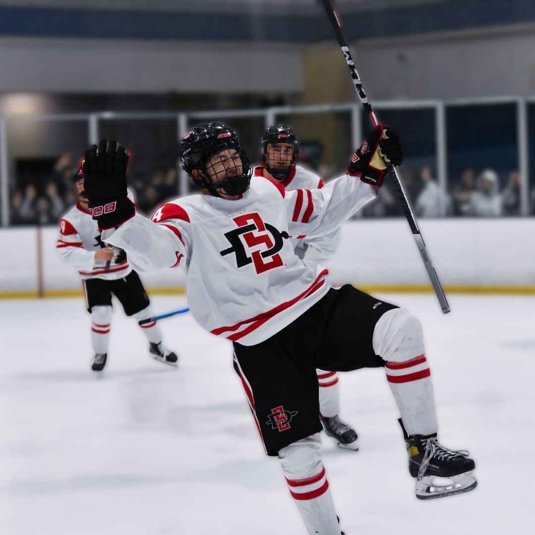 3 SDSU Ice Hockey members on ice during game