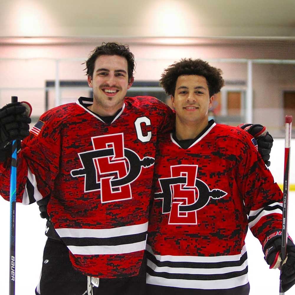 Two smiling Ice Hockey club members after a game