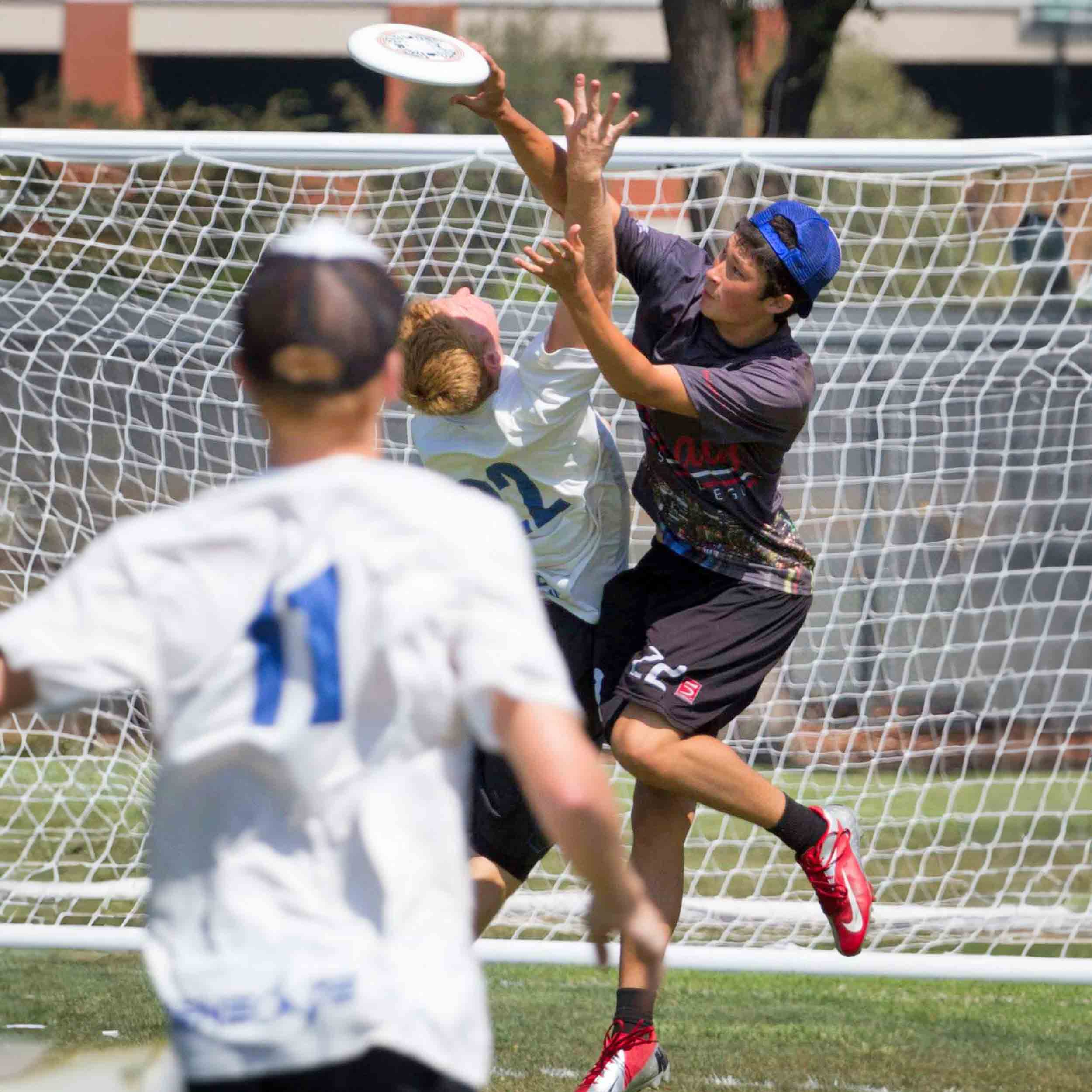 Men's Ultimate Player Catching the Frisbee during a game