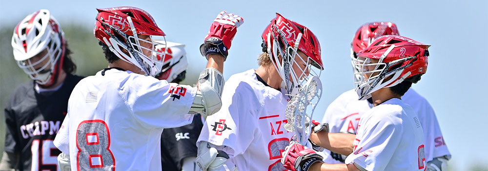 Men's Lacrosse Players high fiving each other