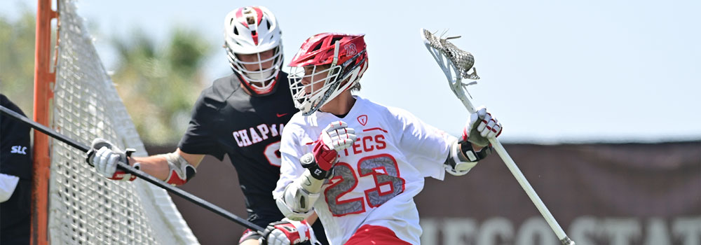 Men's Lacrosse Club player running by opponent