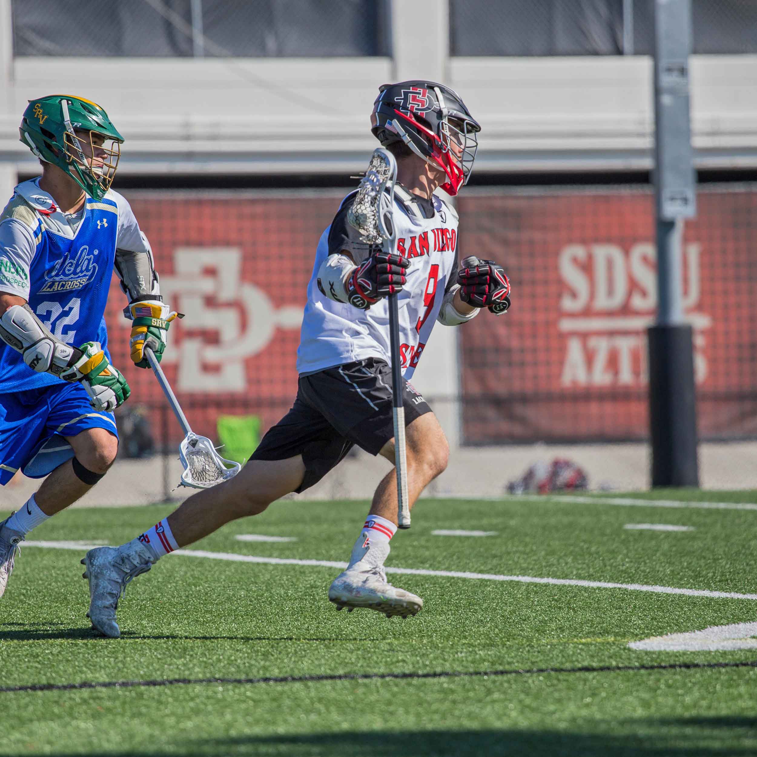 Men's Lacrosse Team member running on the field during a game