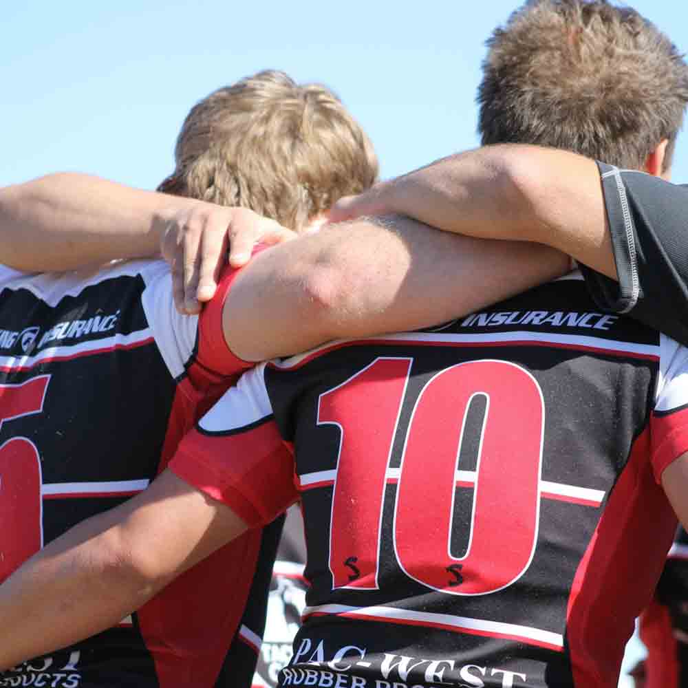 SDSU Men's Rugby Club players in a huddle