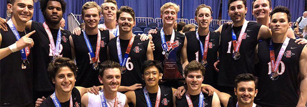 The Men's Club Volleyball team posing with their NCVF Collegiate Volleyball Championship medals