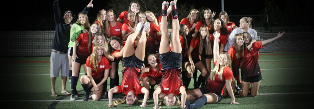Women's Club Soccer team posing for a photo