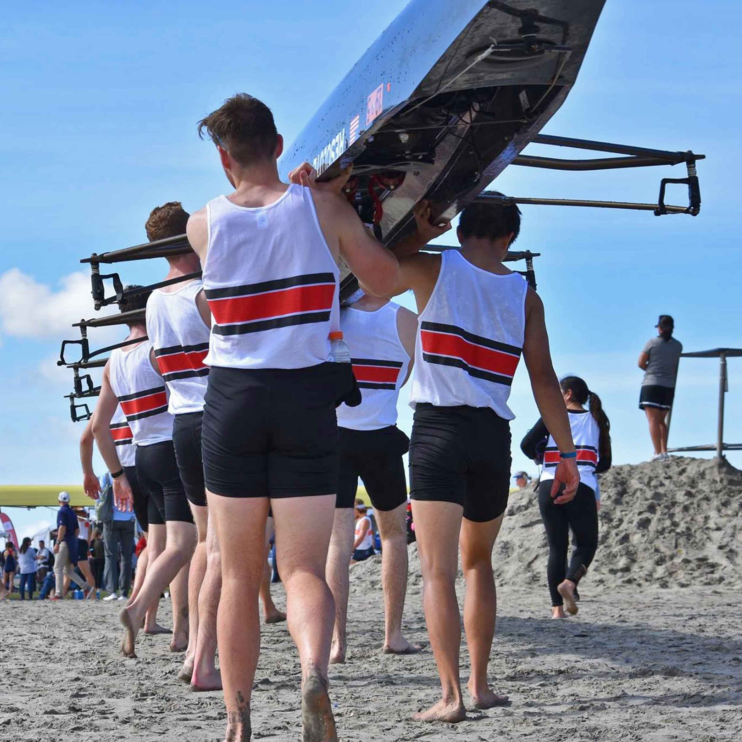 Rowing members carrying rowing boat