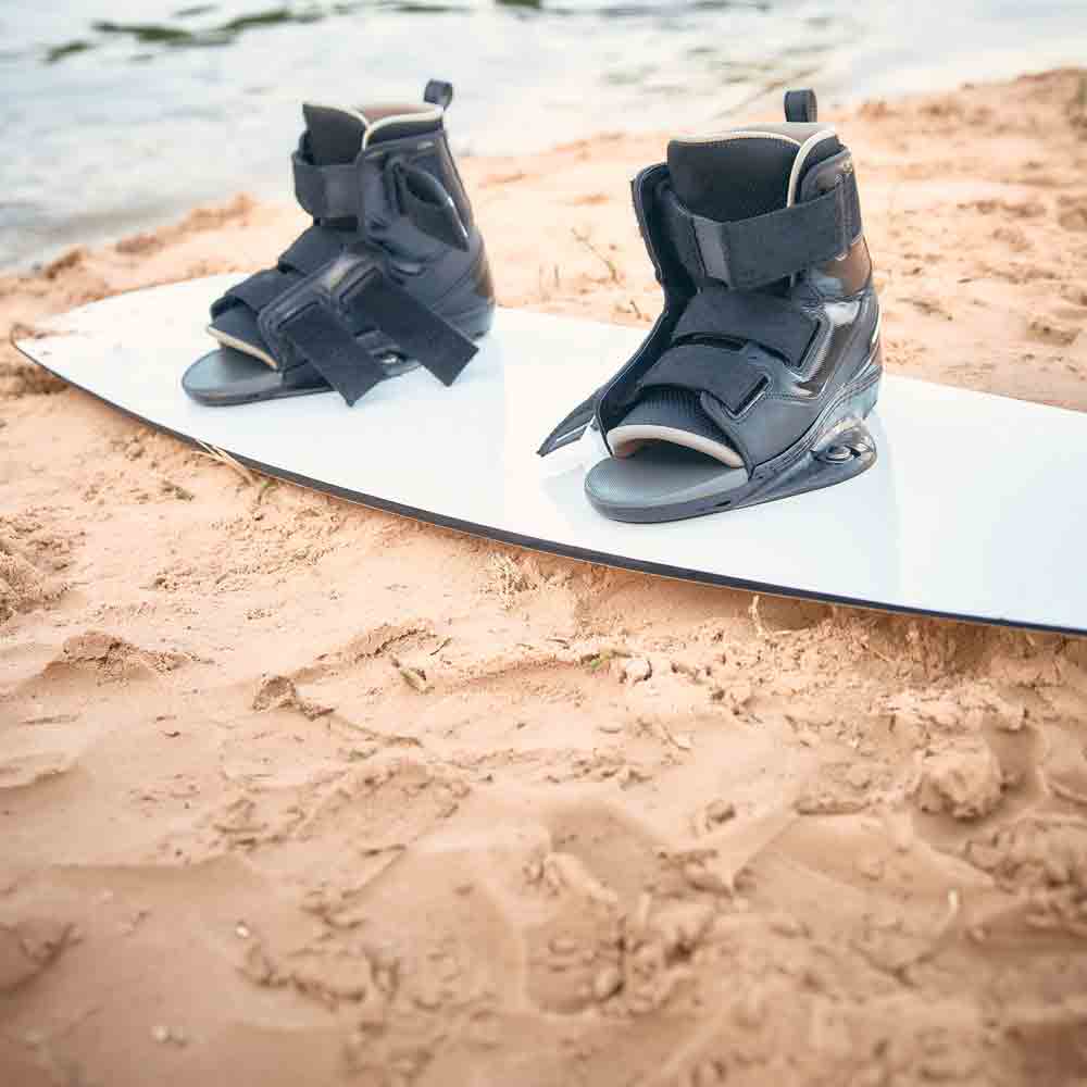 Wakeboarder board laying in the sand on the beach