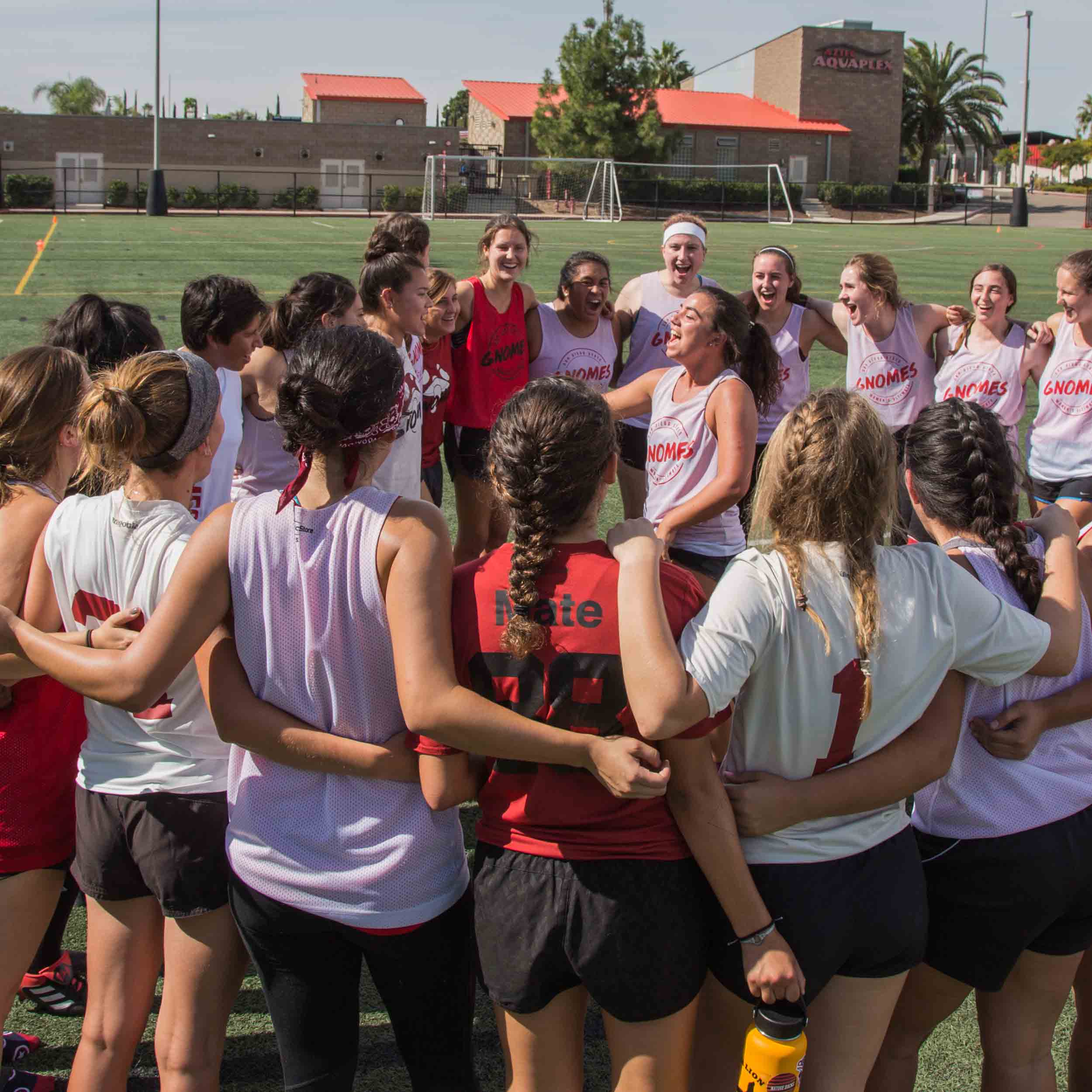 Women's Ultimate Frisbee Club members huddle