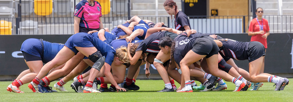 Women's Rugby playing against an opponent
