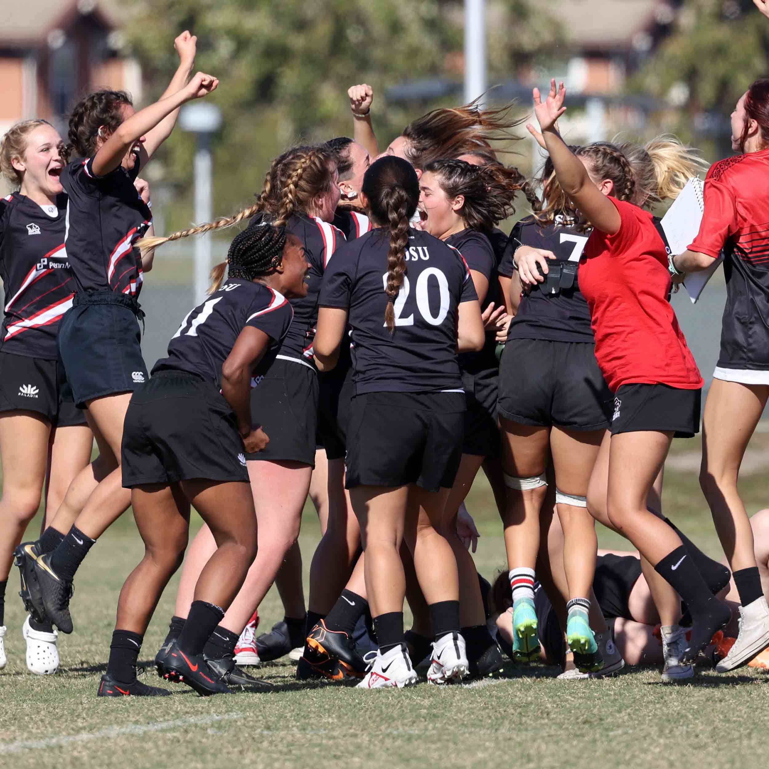 Women's Rugby Club team celebration huddle